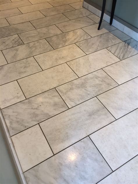white floor tile with light grey grout