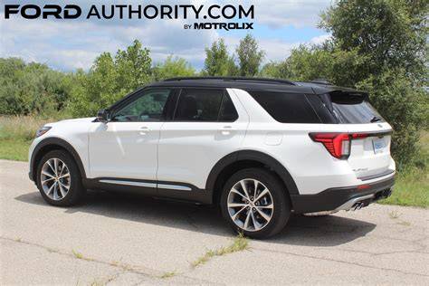 A pristine white Ford Explorer parked in a scenic outdoor setting, highlighting its spaciousness and modern design.