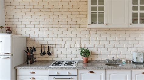 Whitewashed Brick Backsplash With Granite