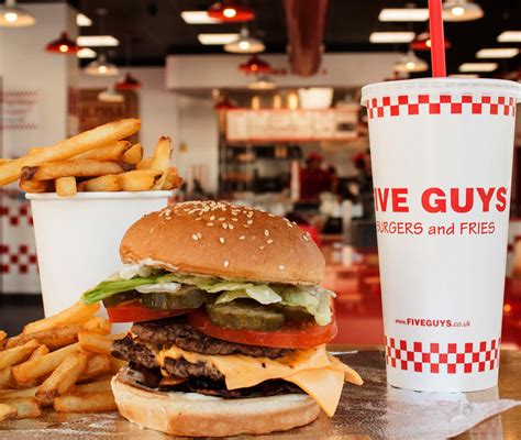 who owns five guys burgers
