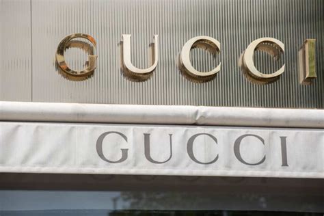 who owns gucci brand