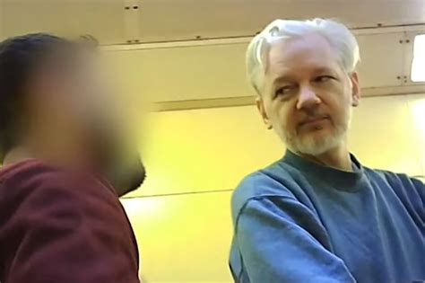 why is julian assange in belmarsh prison