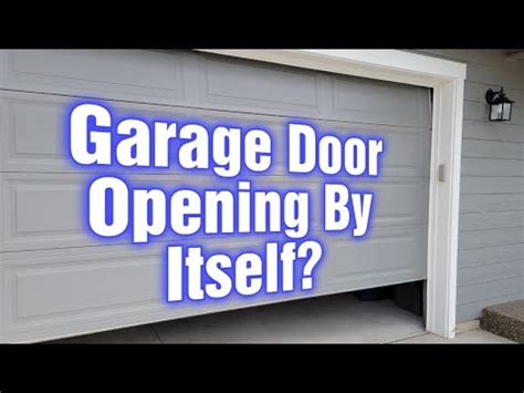 why is my garage door opening by itself