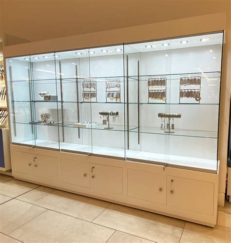 Maximize Your Space and Style with a Wide Display Cabinet - Perfect for Home or Office!