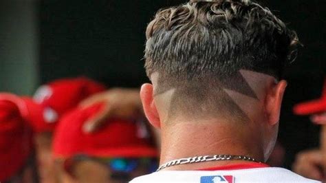 Texas Rangers’ Derek Holland is sporting a ‘Wild Thing’ haircut The