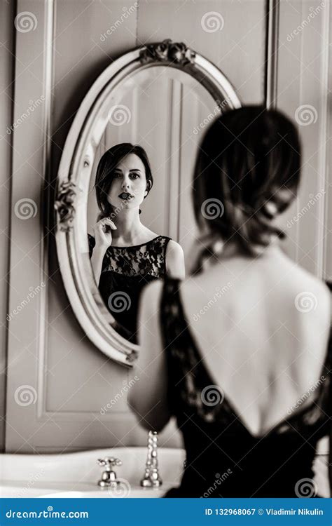 woman in front of a mirror