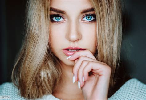 Capture The Beauty Of A Woman With Blue Eyes Photo