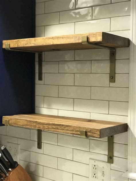 wood shelves with brass brackets