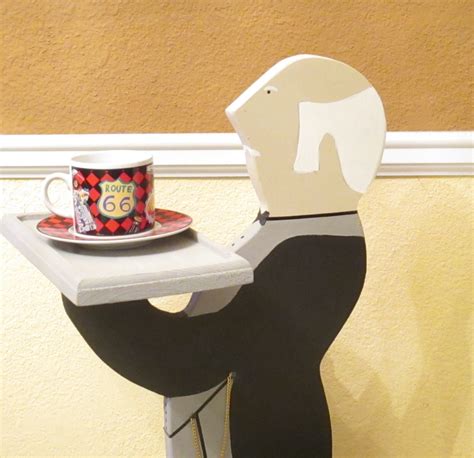 wooden butler statue with tray