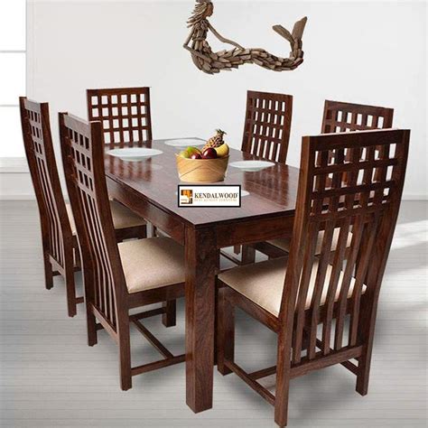wooden dining room table with 6 chairs
