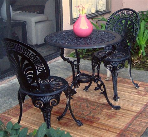 wrought iron bistro table and 2 chairs