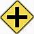 yellow diamond shaped sign with a black cross