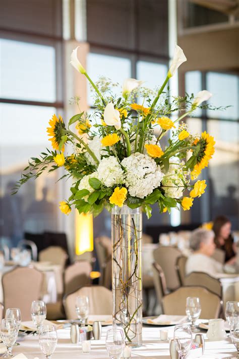 Yellow centerpieces at a private residence in Coopersville, MI. Hetler