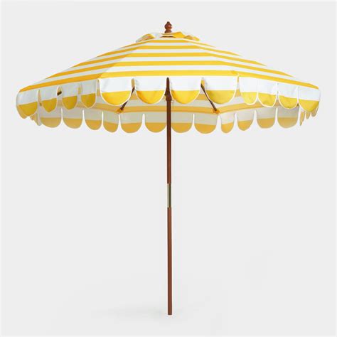 yellow and white striped patio umbrella