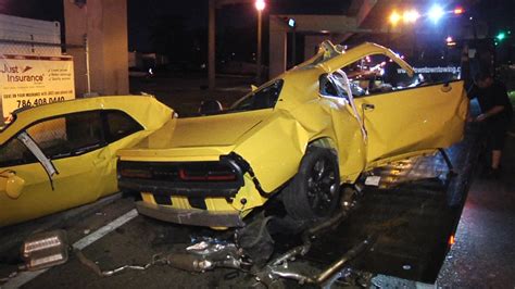 yellow dodge challenger crash