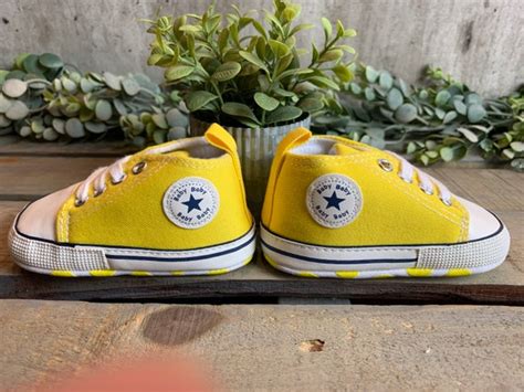 yellow infant converse