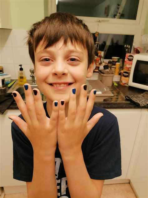 young boy painted nails