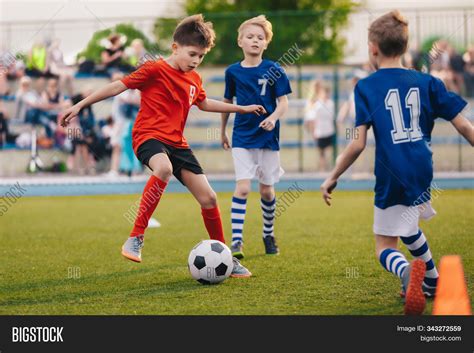 young boys playing football